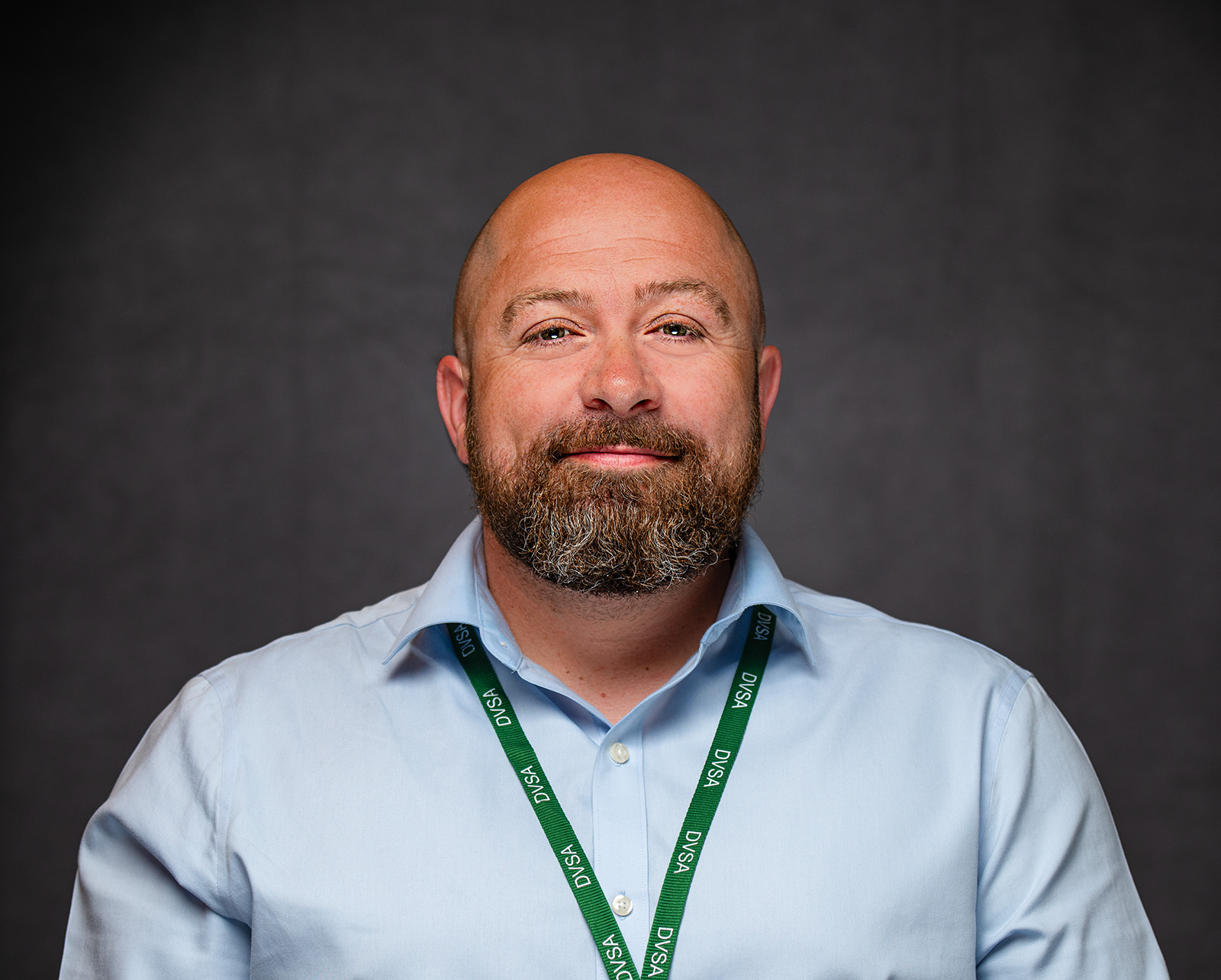 Approachable corporate headshot of a smiling professional