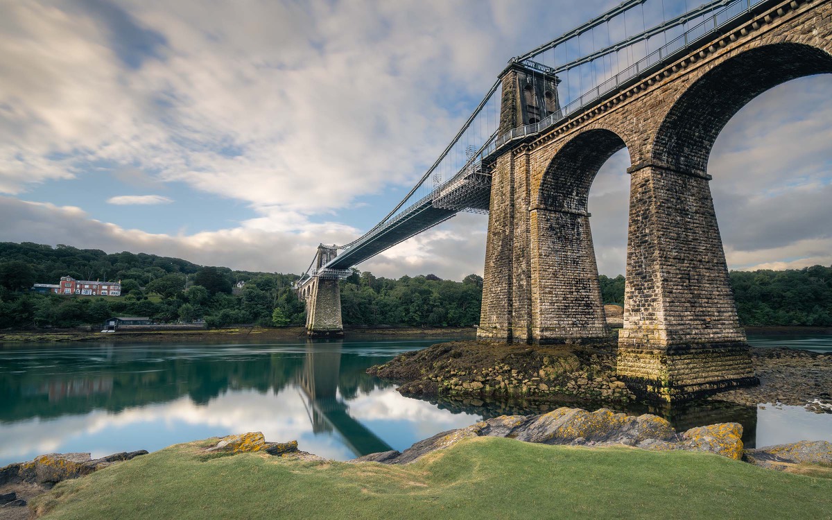 Menai Suspension Bridge crossing the water beneath a broad sky