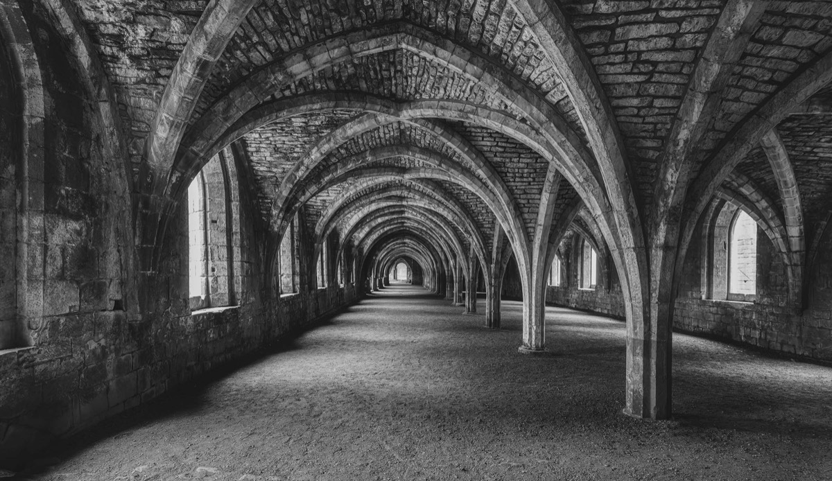 Repeating stone vaults inside a historic undercroft